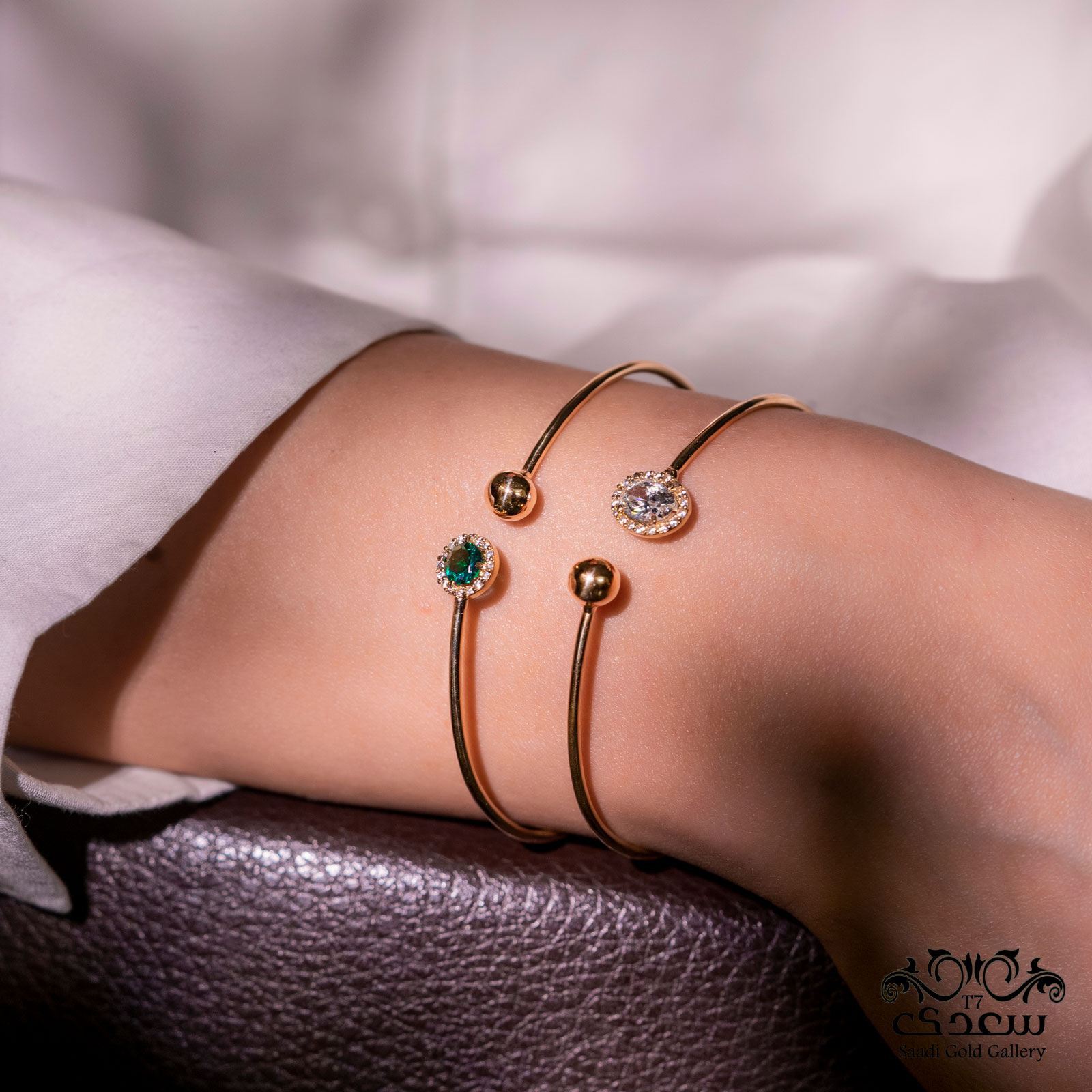 a woman who is wearing two bangles